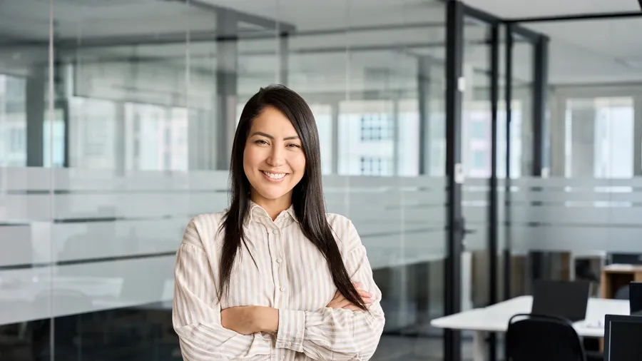 Business professional standing in a modern office